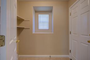 Patterson house for rent - A small room with a window and two doors.