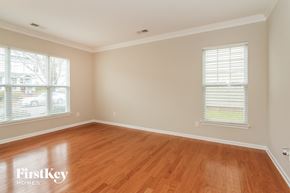 Huntersville house for rent - a living room with wood floors and two windows