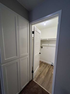 Bakersfield apartment for rent - a bedroom with a closet and a door open to a bathroom