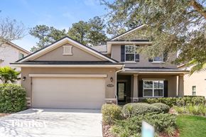 Jacksonville house for rent - A two-story house with a garage and a driveway.