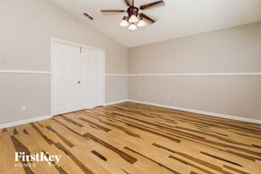 Lake Mary house for rent - the living room has a hardwood floor and a ceiling fan