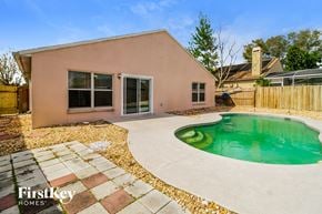 Lake Mary house for rent - a backyard with a pool and a house