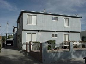 North Hollywood apartment for rent - a white house with a fence and a driveway
