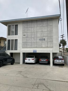 Los Angeles apartment for rent - A black car is parked in front of a building with the number 4176 on it.