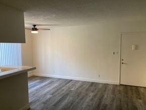 Los Angeles apartment for rent - A room with a ceiling fan and a door.