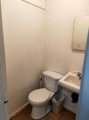 Vancouver apartment for rent - A white toilet and sink in a small bathroom.