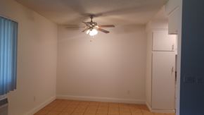Van Nuys apartment for rent - an empty living room with a ceiling fan