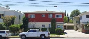 Van Nuys apartment for rent - a white truck parked in front of a red house