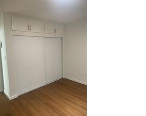 Van Nuys apartment for rent - an empty bedroom with white walls and wood floors