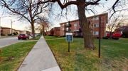 Oak Lawn apartment for rent - a sidewalk with a sign in front of a building