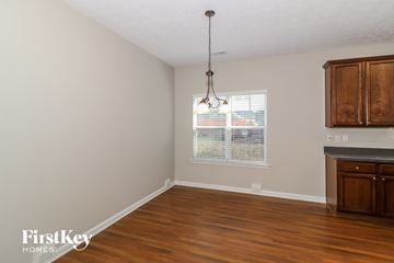 Sugar Hill house for rent - a kitchen with wooden floors and a window and wooden cabinets