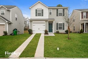 Charlotte house for rent - A house with a green trash can in front of it.