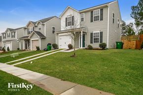 Charlotte house for rent - A row of houses with a FirstKey Homes logo.