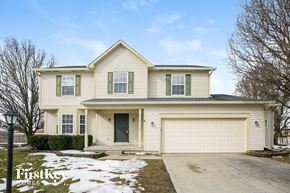 Brownsburg house for rent - A two-story house with a garage and a driveway.