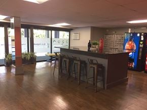 Greensboro apartment for rent - the lobby of a restaurant with a bar and stools