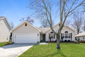 Charlotte house for rent - a white house with a tree in the front yard