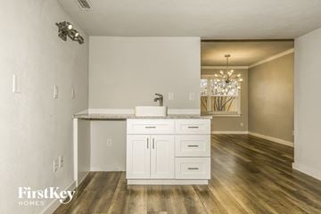 Carrollton house for rent - a kitchen and living room with a sink and a counter