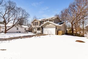 Weldon Spring house for rent - a house in the snow with a garage door