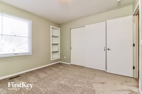 Weldon Spring house for rent - a bedroom with two white closets and a window