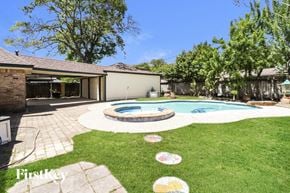 Houston house for rent - a backyard with a pool and a house