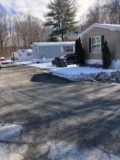 Claverack apartment for rent - a house with a car parked in front of it in the snow