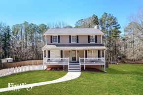 Alabaster house for rent - a house with a white picket fence in front of a yard