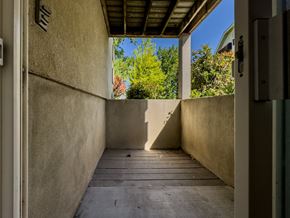 Provo apartment for rent - a long porch with a view of trees and a blue sky