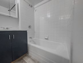 Provo apartment for rent - a white bathroom with a tub and a sink