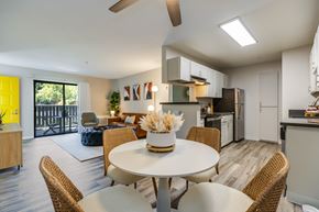 Hayward apartment for rent - A modern dining room with a white table and chairs.
