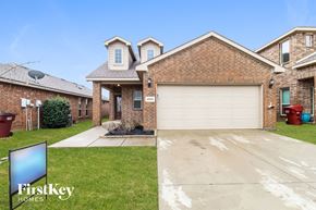 Royse City house for rent - a house with a garage and a driveway in front of it