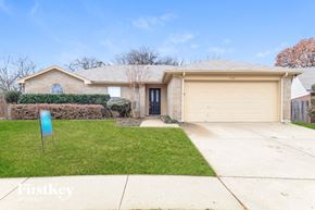 Arlington house for rent - A house with a garage and a driveway is for sale.
