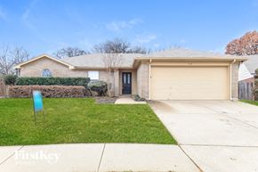Arlington house for rent - A house with a garage and a sign that says "FirstKey Homes".