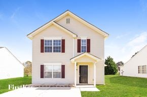 Charlotte house for rent - a white house with red shutters and a lawn