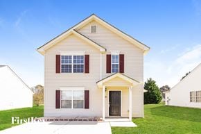 Charlotte house for rent - a white house with red shutters and a lawn
