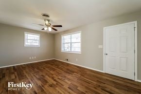 Smyrna house for rent - a living room with wood floors and a ceiling fan