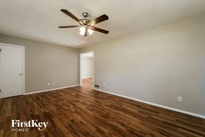 Smyrna house for rent - a living room with hardwood flooring and a ceiling fan