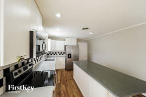 Smyrna house for rent - a renovated kitchen with stainless steel appliances and white cabinets