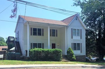 Charlottesville apartment for rent - a white house with a ladder on the side of it