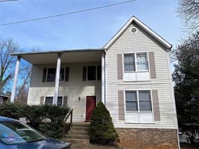 Charlottesville apartment for rent - a white house with a red door and a car in front of it