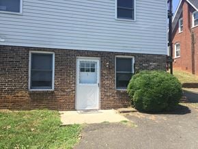 Charlottesville apartment for rent - the front of a brick house with a white door