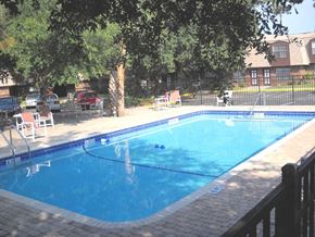 Port Orange apartment for rent - a large swimming pool with chairs around it