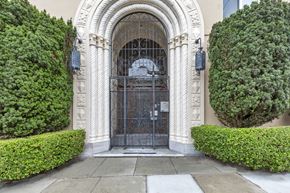 San Francisco apartment for rent - A large, ornate gate is the centerpiece of a well-manicured entrance.