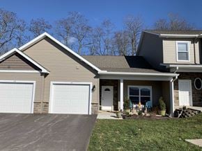 Penn Yan apartment for rent - a tan house with a white garage door