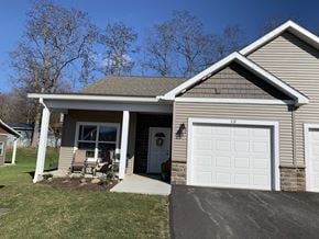 Penn Yan apartment for rent - a tan house with a white garage door