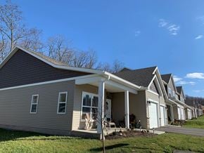 Penn Yan apartment for rent - a row of houses with a blue sky in the background