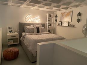 Boston apartment for rent - A bedroom with a bed, nightstand, and a lamp.