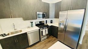 Elizabeth apartment for rent - a kitchen with stainless steel appliances and a refrigerator