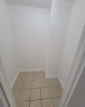 Miami Beach apartment for rent - a room with a tiled floor and white walls