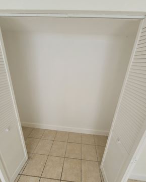 Miami Beach apartment for rent - an empty room with a closet and a tiled floor