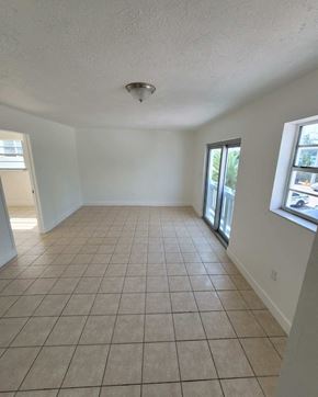 Miami Beach apartment for rent - an empty living room with a tiled floor